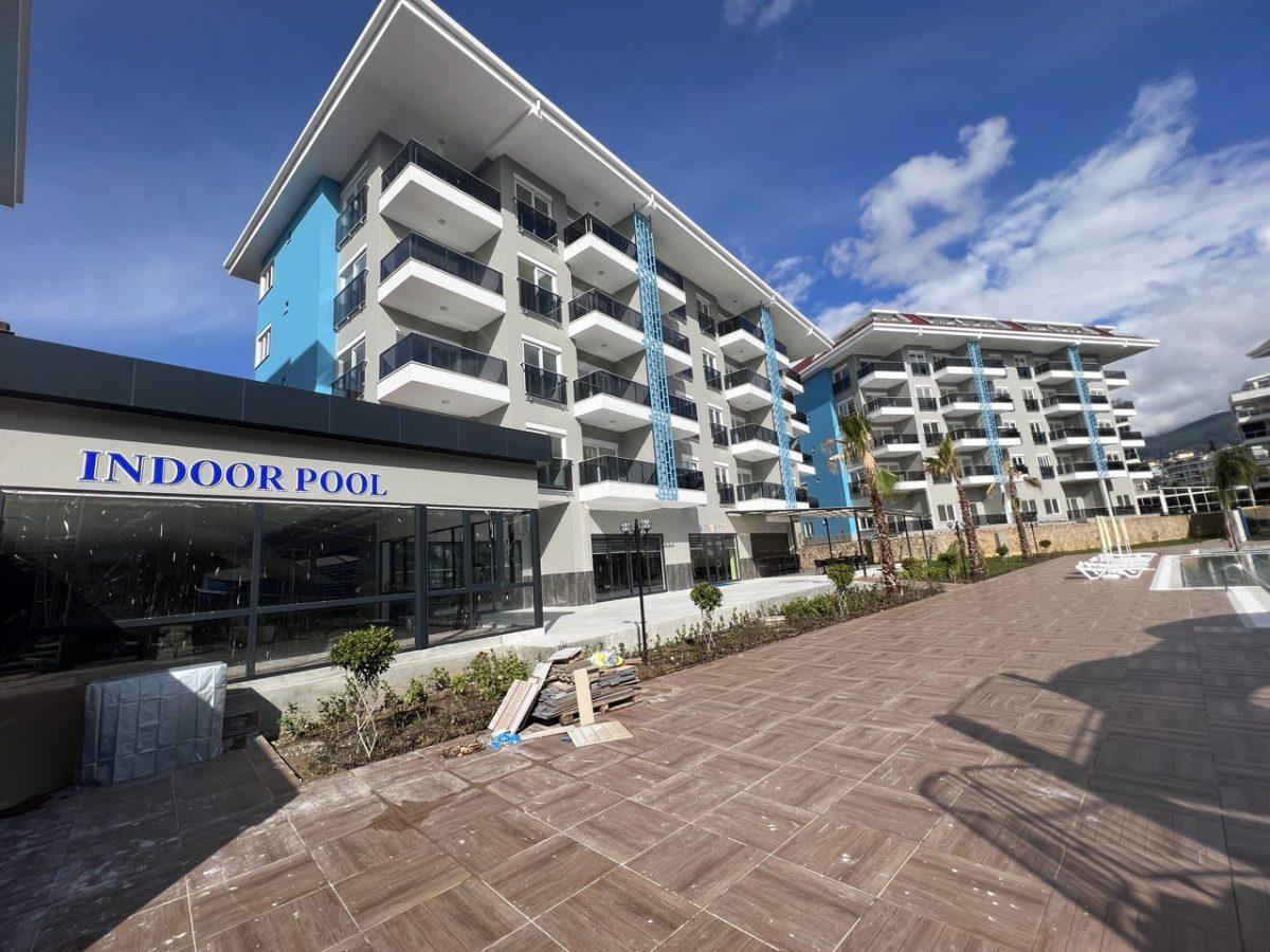 Квартира с 2 комнатами в Кестель, Турция № 43930